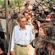 Physicist Dr. Richard Kinder is mobbed by paparazzi outside his University of Chicago office.